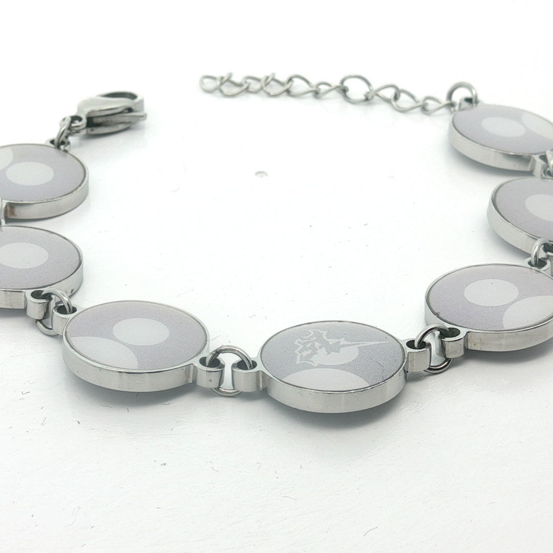 Silver bracelet with circular links on a white background