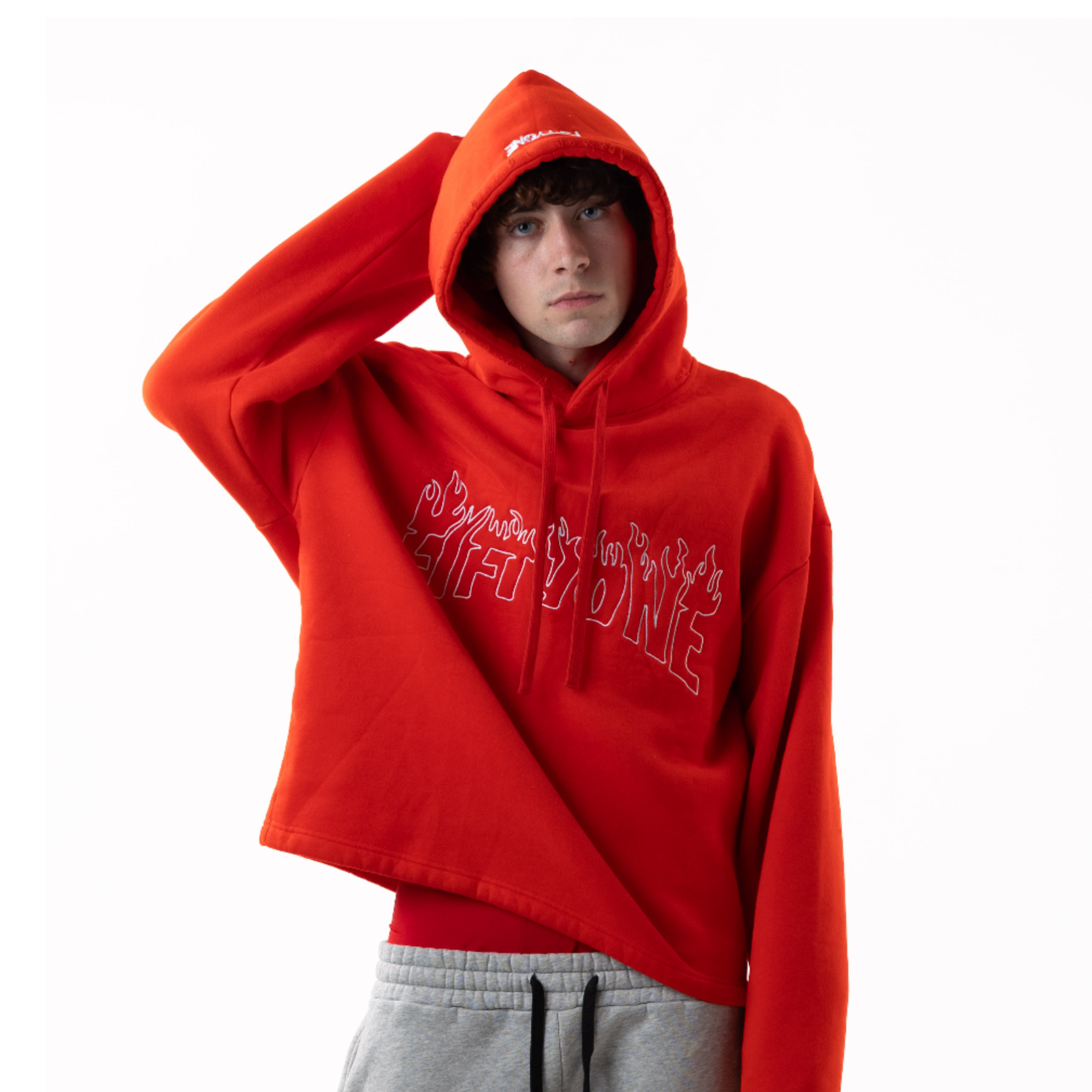 Person wearing a red hoodie with text on a white background