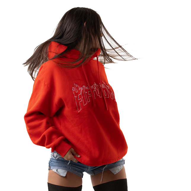 Person wearing a red hoodie with text on the back, standing against a white background